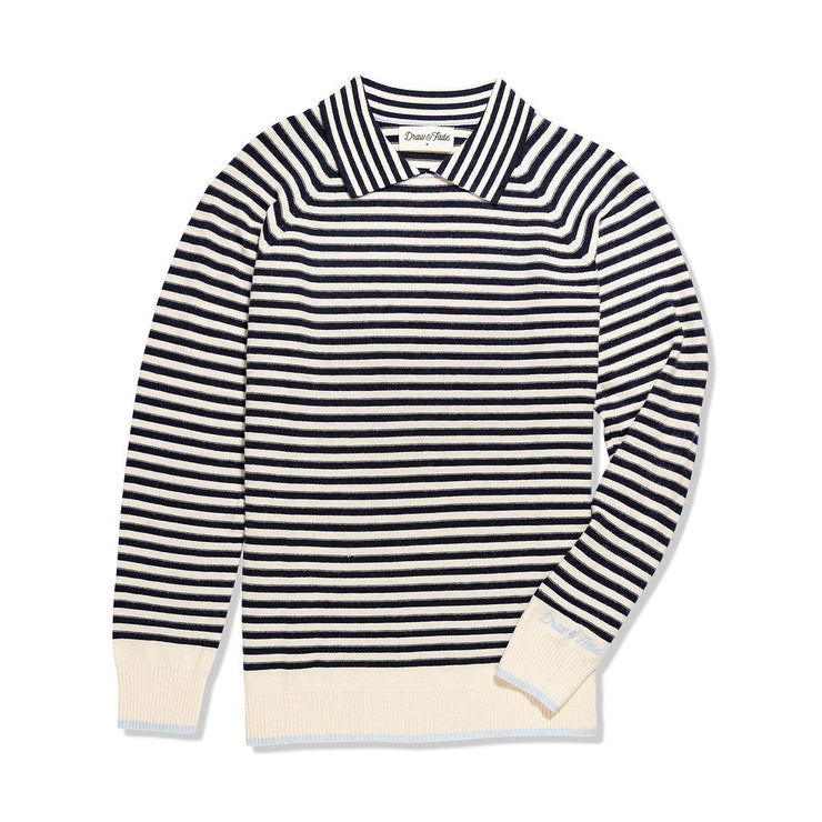 Blue and white striped sweater with cream cuffs and hem on a white background
